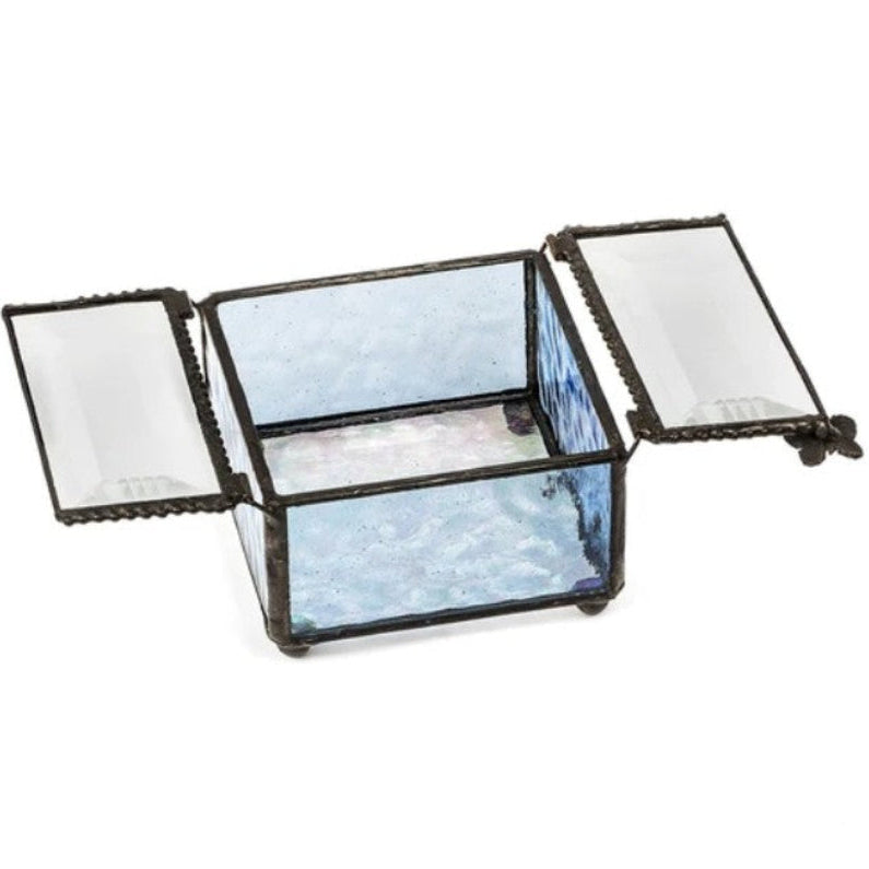 A small rectangular glass keepsake box with an open lid, featuring light blue marbled stained glass panels and a dark metal frame with decorative trim.