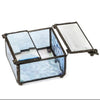A small decorative glass storage box with a hinged lid, featuring textured light blue and white patterned glass panels set in dark metal frames, shown open on a white background.