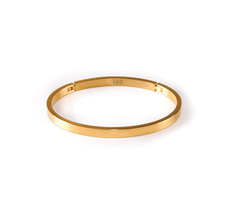 simplicity stainless steel bangle by b. tiff new york gold